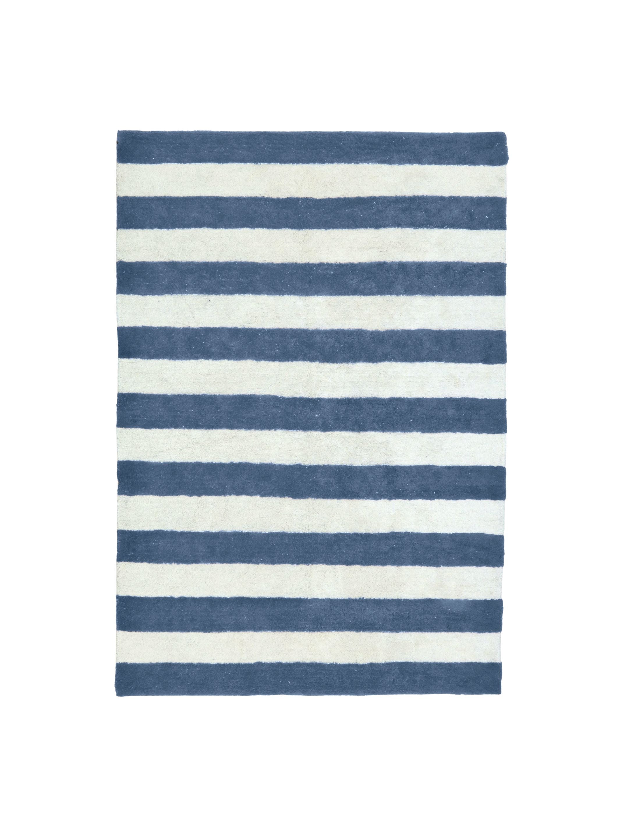 Striped blue and white rug on a white background