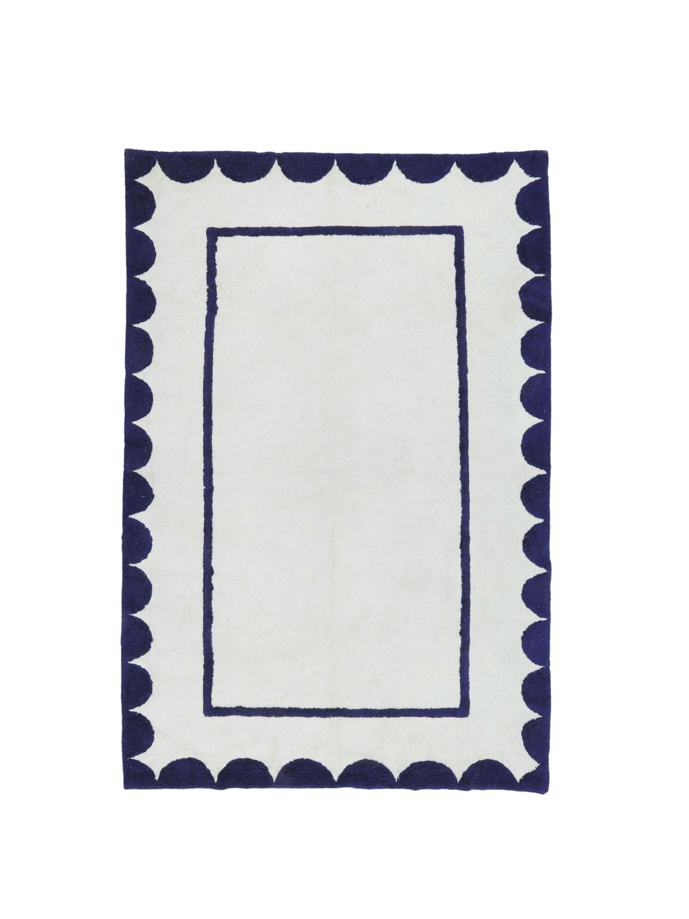 Natural rug with dark blue scallop details